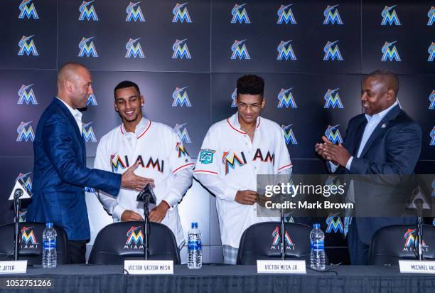 Chief Executive Officer Derek Jeter of the Miami Marlins, Cuban baseball players and brothers Victor Victor Mesa, Victor Mesa Jr., and President of...