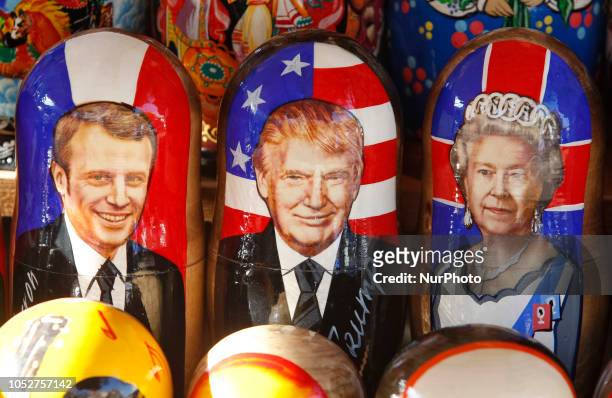 Painted nesting dolls with portraits of French President Emmanuel Macron, U.S. President Donald Trump and Britain's Queen Elizabeth II are offered in...