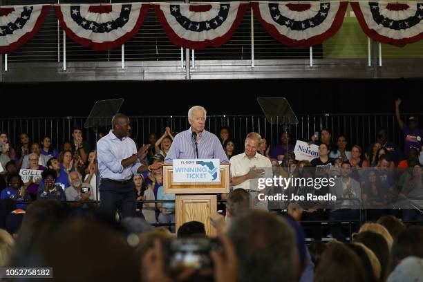 Former Vice President Joe Biden speaks as Florida Democratic gubernatorial nominee Andrew Gillum and U.S. Sen. Bill Nelson listen behind him during a...