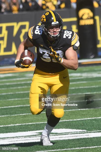 Iowa Hawkeyes tight end T.J. Hockenson runs with the ball after making a catch in the second half during a Big Ten Conference football game between...