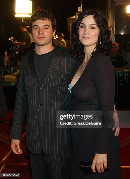 Carrie-Anne Moss and Steven Roy during "The Matrix Revolutions" Premiere at Disney Concert Hall in Los Angeles, California, United States.