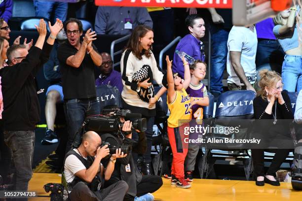 Natalie Portman, her son Aleph Portman-Millepied and a friend attend a basketball game between the Los Angeles Lakers and the San Antonio Spurs at...