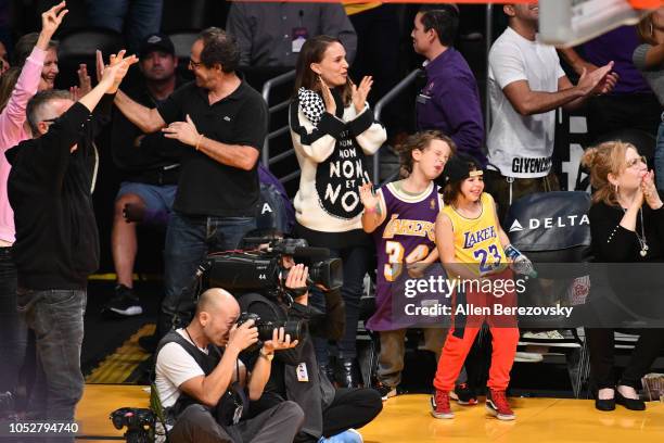 Natalie Portman, her son Aleph Portman-Millepied and a friend attend a basketball game between the Los Angeles Lakers and the San Antonio Spurs at...