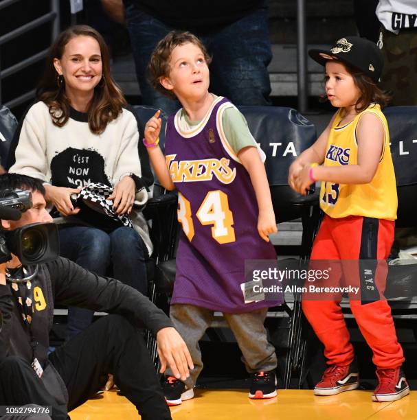 Natalie Portman, her son Aleph Portman-Millepied and a friend attend a basketball game between the Los Angeles Lakers and the San Antonio Spurs at...