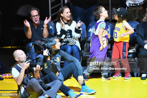 Natalie Portman, her son Aleph Portman-Millepied and a friend attend a basketball game between the Los Angeles Lakers and the San Antonio Spurs at...