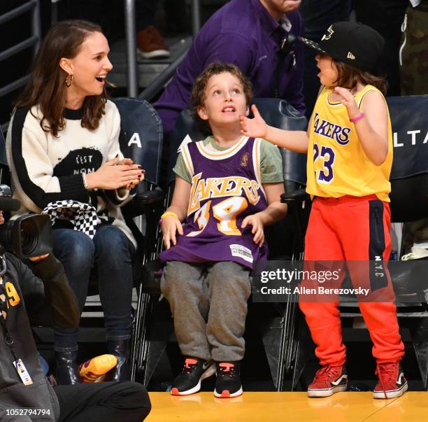 Natalie Portman, her son Aleph Portman-Millepied and a friend attend a basketball game between the Los Angeles Lakers and the San Antonio Spurs at...