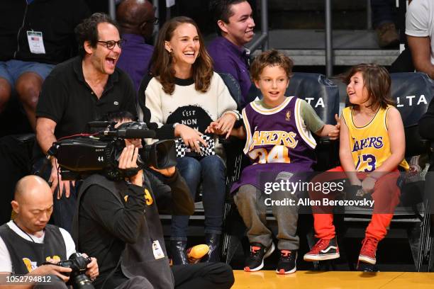 Natalie Portman, her son Aleph Portman-Millepied and a friend attend a basketball game between the Los Angeles Lakers and the San Antonio Spurs at...