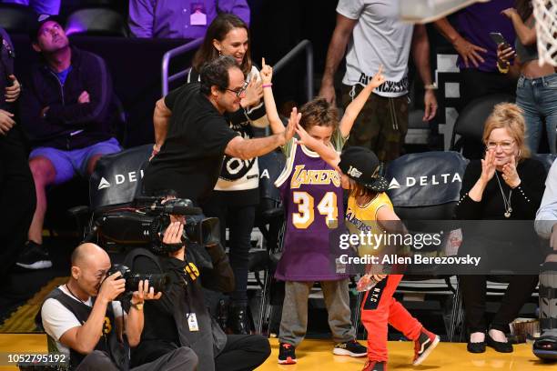 Natalie Portman, her son Aleph Portman-Millepied and a friend attend a basketball game between the Los Angeles Lakers and the San Antonio Spurs at...