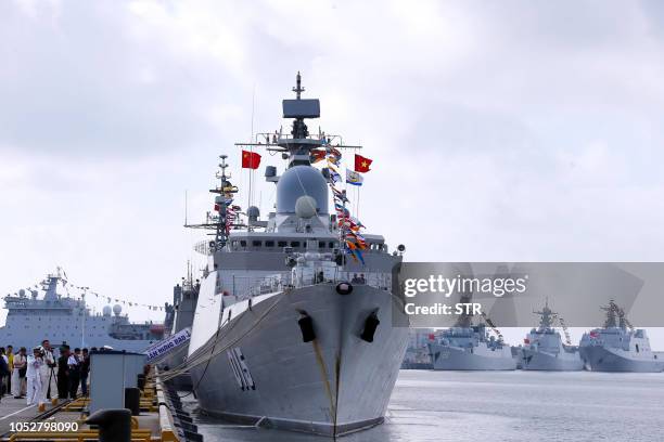 This photo taken on October 22, 2018 shows a Vietnamese navy ship near Chinese navy ships at a military port in Zhanjiang, in China's southern...