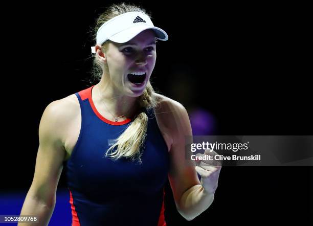 Caroline Wozniacki of Denmark reacts to match point in her singles match with Petra Kvitova of the Czech Republic prior to their singles match during...