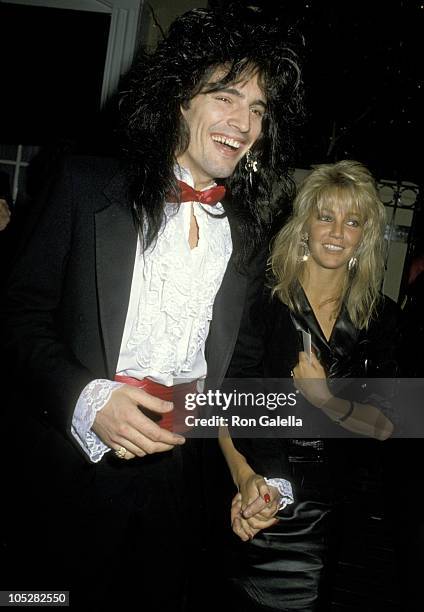 Tommy Lee and Heather Locklear during Aaron Spelling Party at L'Ermitage Restaurant in Los Angeles, California, United States.