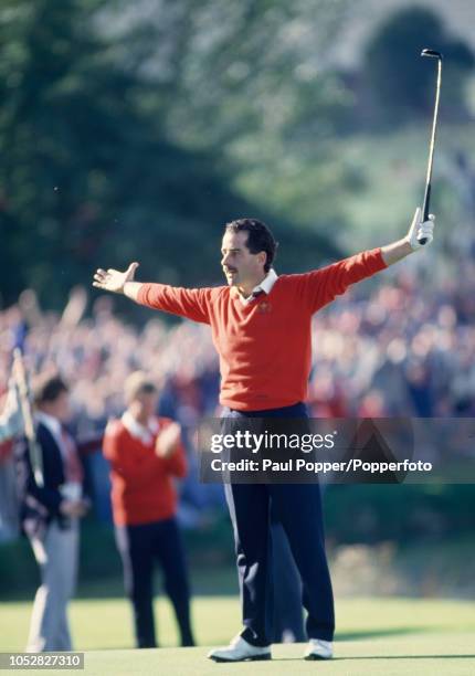 Sam Torrance of Team Europe makes his putt on the 18th green and Europe win the Ryder Cup Matches at The Belfry in Wishaw, England on 15th September...