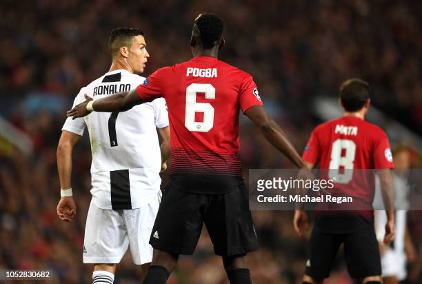 Paul Pogba of Manchester United pats Cristiano Ronaldo of Juventus on the back during the Group H match of the UEFA Champions League between...