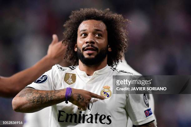 Real Madrid's Brazilian defender Marcelo celebrates his team's second goal during the UEFA Champions League group G football match between Real...