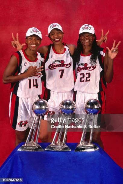 Cynthia Cooper, Tina Thompson and Sheryl Swoopes of the Houston Comets poses for a portrait during Game Three of the 1999 WNBA Finals on September 5,...