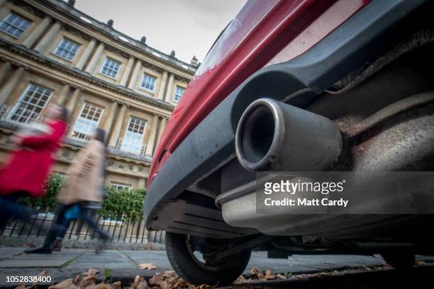 Car is parked on the Grade 1 listed Circus on October 23, 2018 in Bath, England. The historic city of Bath, a UNESCO World Heritage site, is...