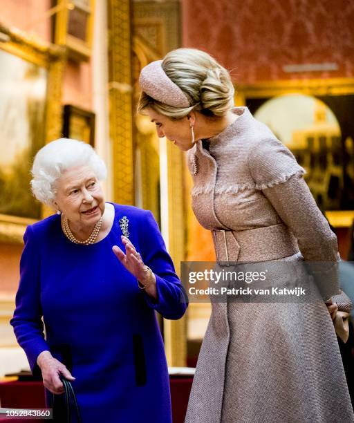 Queen Elizabeth II and Queen Maxima of The Netherlands visit the Picture Gallery in Buckingham Palace on October 23, 2018 in London, United Kingdom....