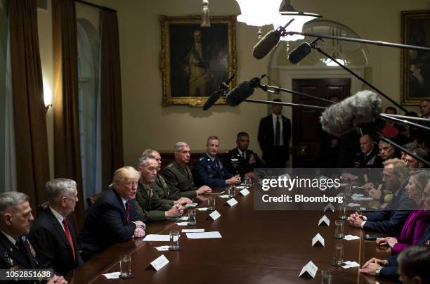 President Donald Trump, third left, speaks as Jim Mattis, U.S. Secretary of defense, left, and General Joseph Dunford, chairman of the Joint Chiefs...