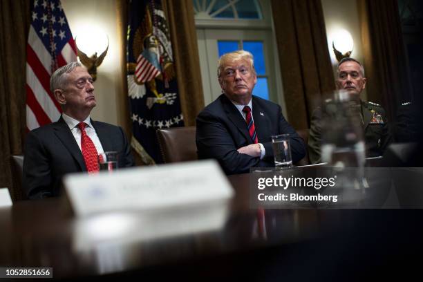 President Donald Trump, center, waits to speak while seated next to Jim Mattis, U.S. Secretary of defense, left, and General Joseph Dunford, chairman...