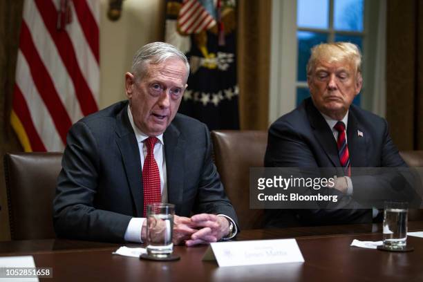 Jim Mattis, U.S. Secretary of defense, left, speaks while seated next to U.S. President Donald Trump, right, during a briefing with senior military...