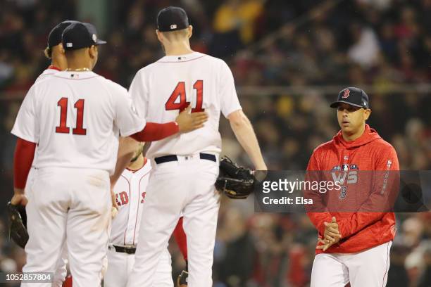 Manager Alex Cora of the Boston Red Sox goes to the mound to take Chris Sale out of the game during the fifth inning against the Los Angeles Dodgers...