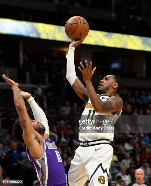 Denver Nuggets guard Monte Morris shoots against Sacramento Kings guard Frank Mason III in the first quarter at the Pepsi Center October 23, 2018.