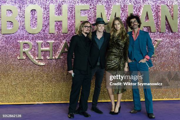 Justin Hawkins, Rufus Tiger Taylor and Frankie Poullain of the Darkness with model Jessica Clarke attend the World Premiere of 'Bohemian Rhapsody' at...