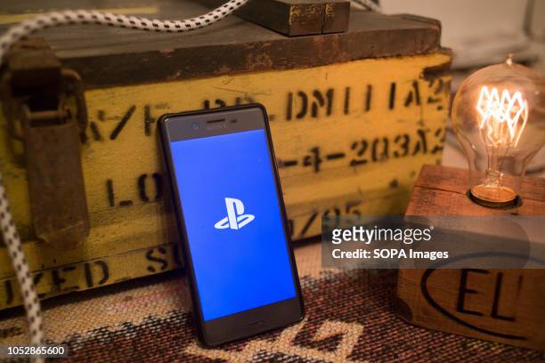 In this photo illustration, the PlayStation application seen displayed on a Sony smartphone.