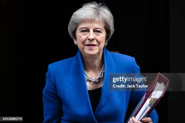 British Prime Minister Theresa May leaves Number 10 Downing Street on October 24, 2018 in London, England. Mrs May is expected to discuss the ongoing...