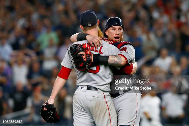 Craig Kimbrel and Christian Vazquez of the Boston Red Sox celebrate after defeating the New York Yankees in Game Four to win the American League...