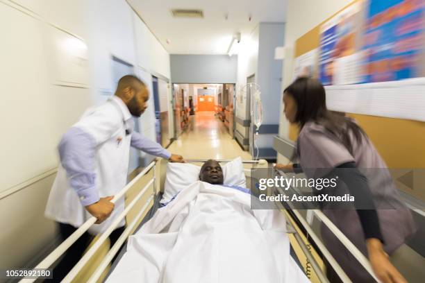 Doctor Rushing Patient In Emergency Room Doctors Pushing Patient On Gurney Blurred Motion Photos ...