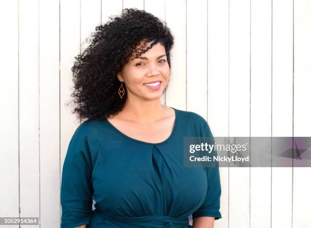 beautiful mixed race woman striking a pose - beautiful voluptuous women stock pictures, royalty-free photos & images