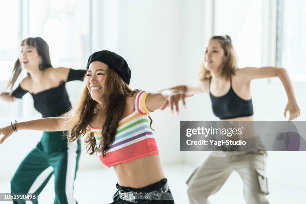 young female dancer dancing at dance studio. - hip hop culture stock pictures, royalty-free photos & images