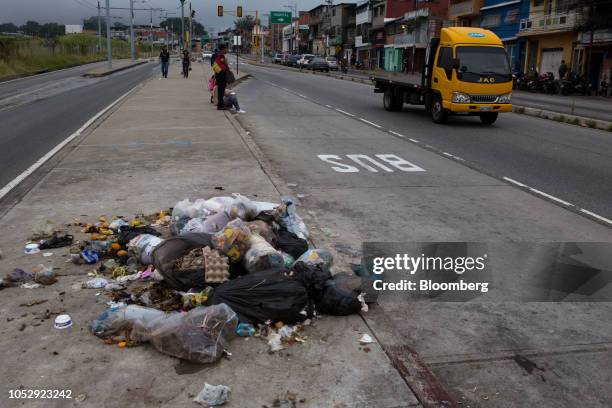 Trash that has been sorted through sits near a bus stop in Merida, Venezuela, on Friday, Sept. 28, 2018. Suicides are rapidly rising across...