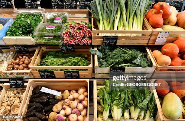 Organic vegetables are on sale in an organic supermarket in Saintes, western France, on October 23, 2018. According to the public information...