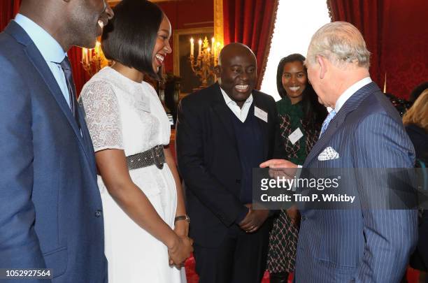 Prince Charles, Prince of Wales talking with Editor of British Vogue, Edward Enninful at a reception to mark their upcoming tour to Gambia, Ghana and...
