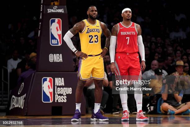 LeBron James of the Los Angeles Lakers and Carmelo Anthony of the Houston Rockets wait for and inbound at Staples Center on October 20, 2018 in Los...