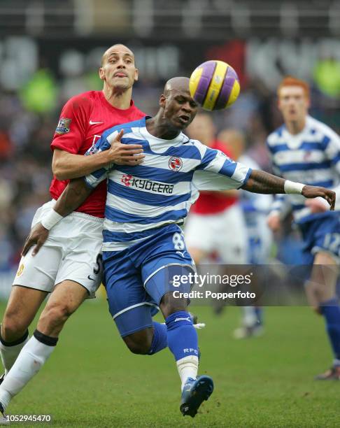 Rio Ferdinand of Manchester United competes with Leroy Lita of Reading during the Barclays Premier League match between Reading and Manchester United...