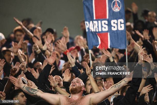 Paris Saint-Germain supporters cheer and chant slogans for their team prior to the UEFA Champions League Group C football match between Paris...