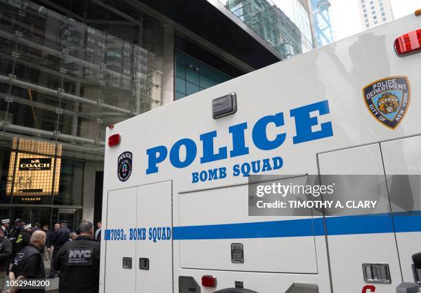 New York Police Department Bomb Squad vehicle is parked outside the Time Warner Building on October 24 after an explosive device was delivered to...