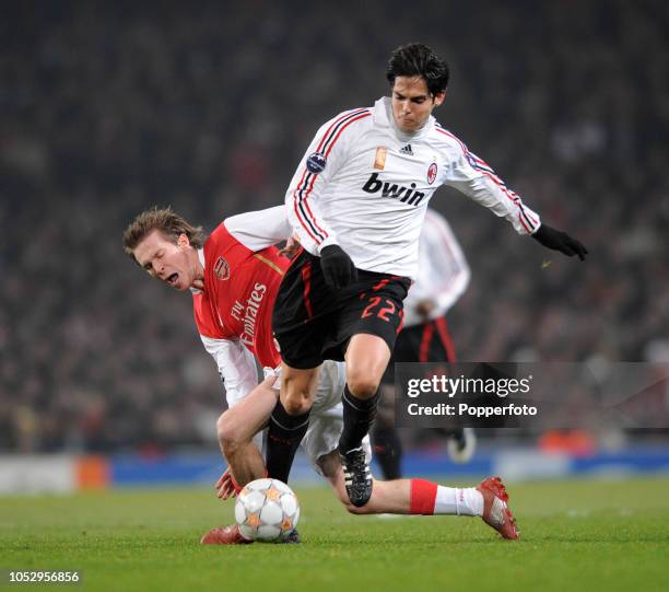 Aleksandr Hleb of Arsenal challenges Kaka of AC Milan during the UEFA Champions League first knockout round 1st leg match between Arsenal and AC...