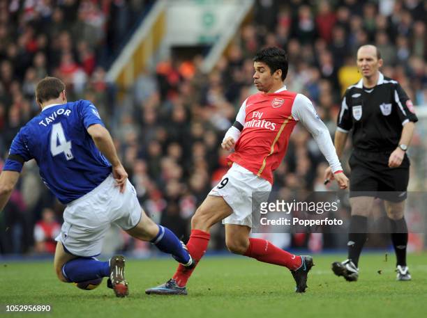Eduardo da Silva of Arsenal is tackled by Martin Taylor of Birmingham City during the Barclays Premier League match between Birmingham City and...
