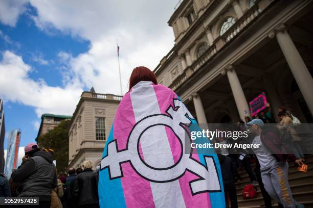 Activists and their supporters rally in support of transgender people on the steps of New York City Hall, October 24, 2018 in New York City. The...