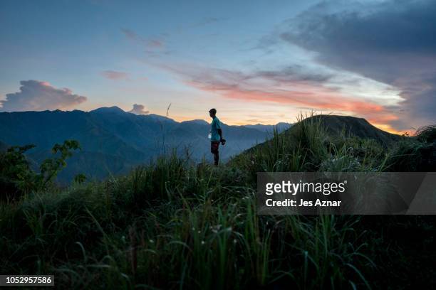 Tamaraw warden trying to locate tmaraws in an early morning patrol on October 14, 2018 in Mansalay, Mindoro province, Philippines. The Tamaraw is one...