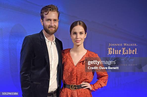 Sam Ritzenberg and Heida Reed attend the unveiling of Johnnie Walker ...