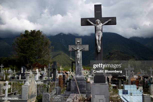 Grave markers stand at a graveyard in Merida, Venezuela, on Wednesday, Sept. 26, 2018. Suicides are rapidly rising across this once-wealthy nation,...