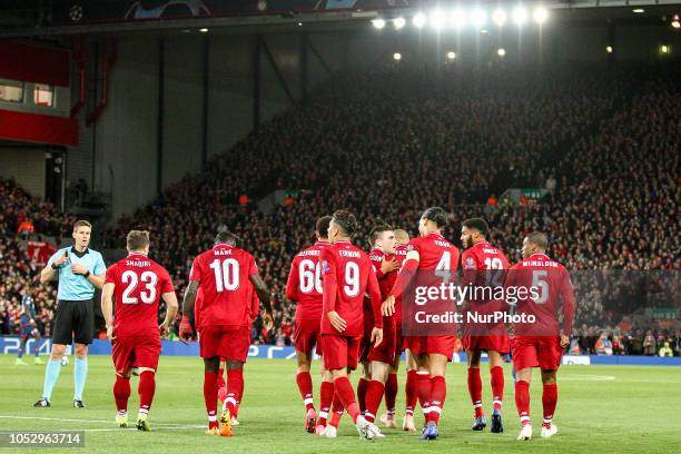 Liverpool forward Roberto Firmino celebrates with his teammates after scoring his goal during the Uefa Champions League Group Stage football match...