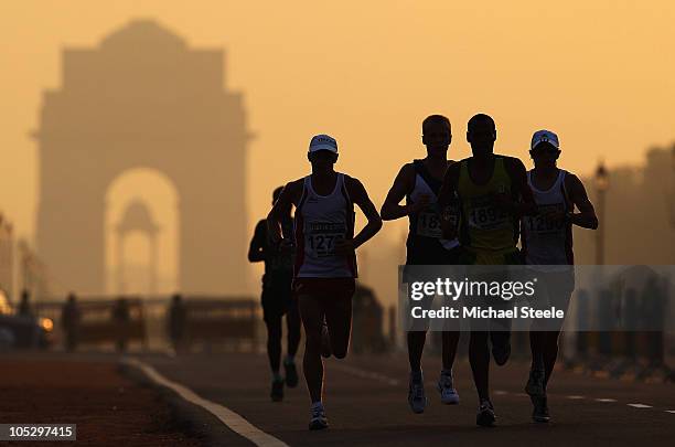 Athletes compete in the Men's Marathon at Vijay Chowk during day eleven of the Delhi 2010 Commonwealth Games on October 14, 2010 in Delhi, India.
