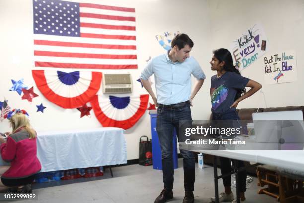 Democratic congressional candidate Josh Harder speaks to a volunteer at a campaign rally in support of Social Security and Medicare on October 24,...