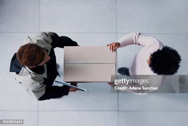 on time and all yours - woman hold box imagens e fotografias de stock